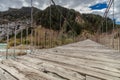 Suspension bridge over the wild river