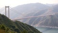 Suspension bridge over mountains, engineering marvel and scenic view Generative AI Royalty Free Stock Photo