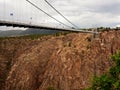 Suspension bridge. Stormy sky.