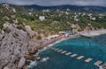 Suspension bridge to the Diva rock, Black Sea coast, Crimea. Panorama of the town of Simeiz Royalty Free Stock Photo