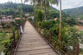 Suspension foot bridge in Muang Khua town, La