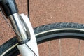 Suspension fork and mountain bike wheel close-up. Cycling for fun and health. Active leisure. A new bike is standing outside on a Royalty Free Stock Photo