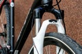 Suspension fork and mountain bike wheel close-up. Cycling for fun and health. Active leisure. A new bike is standing outside on a Royalty Free Stock Photo