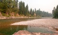 Suspension Bridge over Flathead River at the Spotted Bear Ranger Station / Campground in Montana USA Royalty Free Stock Photo