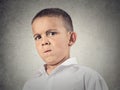 Suspicious boy, full of skepticism Royalty Free Stock Photo