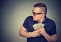 Suspicious greedy man grabbing money Royalty Free Stock Photo