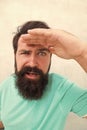 Suspicious look. Man bearded hipster stylish beard grey background. Perceptions of male beauty. Stylish beard and Royalty Free Stock Photo