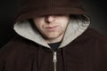 Suspicious Man. Angry young man wearing hoodie