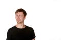 Suspicious young man with light beard, isolated on white, with s Royalty Free Stock Photo