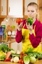 Woman holding bell peppers paprika thinking