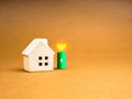 Sustainability at Home concept. Small white toy house near 3d green energy battery power storage symbol. Royalty Free Stock Photo