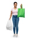 woman comparing reusable and plastic bags