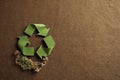 Sustainable Choices: The Green Recycling Symbol on Brown Background, A Visual Pledge for a Greener Earth, ai generative