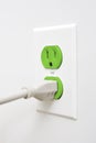 Sustainable clean green energy plug and outlet Royalty Free Stock Photo