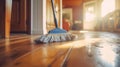 sustainable cleaning. Cleaning Wooden Floor with Mop in Sunlit Room. wooden floor being cleaned with a blue mop Royalty Free Stock Photo