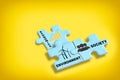 Environment society and economics written on blue puzzle jigsaw with shadow on yellow background