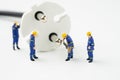Sustainable energy, power consumption or electricity innovation concept, miniature people worker, technician help fixing or Royalty Free Stock Photo