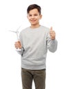 smiling boy with toy wind turbine Royalty Free Stock Photo