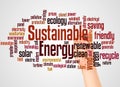 Sustainable energy word cloud and hand with marker concept Royalty Free Stock Photo