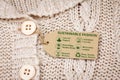 Sustainable fashion label on woollen jumper