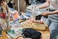 Sustainable fashion. Modern Latina young woman choosing vintage scarf, Royalty Free Stock Photo