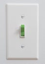 Sustainable green energy light switch Royalty Free Stock Photo