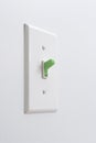 Sustainable green energy light switch Royalty Free Stock Photo