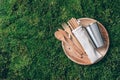 Sustainable lifestyle. Zero waste, plastic free, recycling concept. Stainless steel cup, wooden spoon, fork, knife Royalty Free Stock Photo