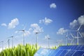 Sustainable natural energy concept with wing turbines and photovoltaic panel under blue sky Royalty Free Stock Photo