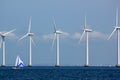 Sustainable Offshore Windfarm with Sailboat Royalty Free Stock Photo