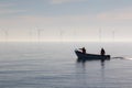 Sustainable resources. Small fishing boat heading out to sea Royalty Free Stock Photo