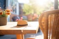 sustainable strawhat on a sunlit patio table Royalty Free Stock Photo