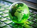 Sustainable Tech A Tiny Globe on a Laptop Keyboard Highlights the Connection Between CarbonNeutral Computing and Global Royalty Free Stock Photo
