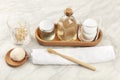 Sustainable toiletries. Homemade lotions, cotton pads, bamboo toothbrush, natural Konjac sponge, and bamboo cotton swabs