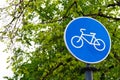 Sustainable transport. Blue road sign or signal of bicycle lane Royalty Free Stock Photo