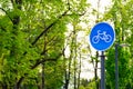 Sustainable transport. Blue road sign or signal of bicycle lane Royalty Free Stock Photo