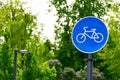 Sustainable transport. Blue road sign or signal of bicycle lane Royalty Free Stock Photo