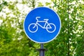 Sustainable transport. Blue road sign or signal of bicycle lane Royalty Free Stock Photo