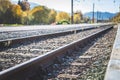 Sustainable traveling by train: Rail track and colorful, idyllic landscape in fall Royalty Free Stock Photo