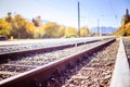 Sustainable traveling by train: Rail track and colorful, idyllic landscape in fall Royalty Free Stock Photo