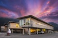 Sustainable wood office building on pillars with parking spaces underneath Royalty Free Stock Photo