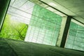 Sustainble green building. Eco-friendly building. Sustainable glass office building with tree for reducing carbon dioxide. Office Royalty Free Stock Photo