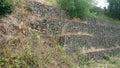 Sustaining Stone Caged Walls stopping landslides Royalty Free Stock Photo