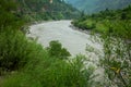 Sutlej or Satluj River flowing through the valleys of Himachal Pradesh. Monsoon season in India