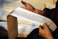 Sutras on the tibetan worker hands. Royalty Free Stock Photo