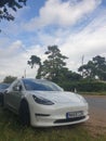 Sutton Suffolk UK August 12 2021: A 2019 model Tesla Model 3 Long-Range Dual Motor AWD electric vehicle parked in a small