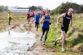 Sutton, Suffolk, UK December 15 2019: A adults over 18 cross country running race through a muddy countryside course