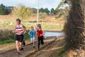 Sutton, Suffolk, UK December 15 2019: A juniors under 18 cross country running race through a muddy countryside course