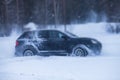 SUV car drifting in snow, during competition, sport car racing drift on snowy race track in winter Royalty Free Stock Photo