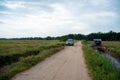 SUV car Honda BRV driving on gravel road or offroad in between paddy fields, Sawah Ring, Malaysia